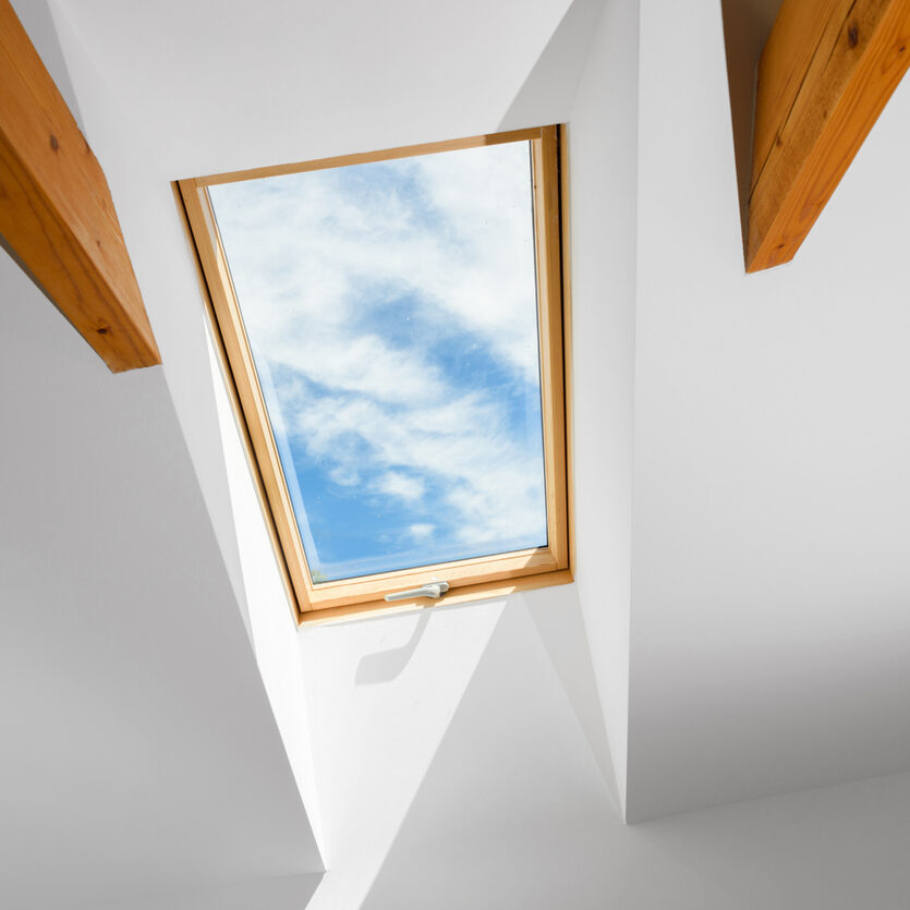 Roow findow with a view to blue cloudy sky